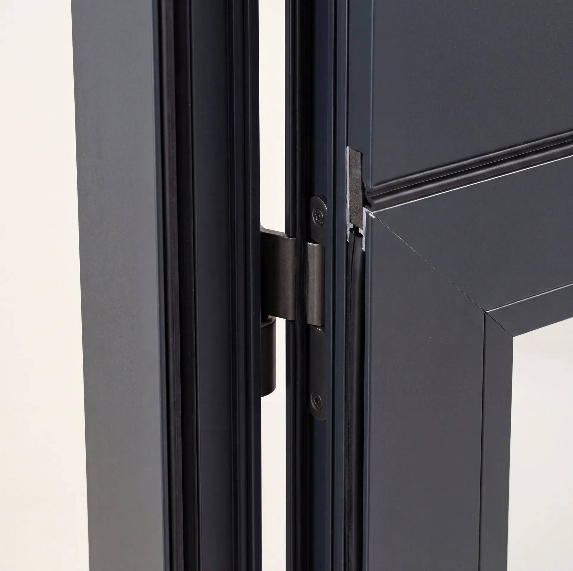 Concealed hinge inside an aluminium door profile, close-up