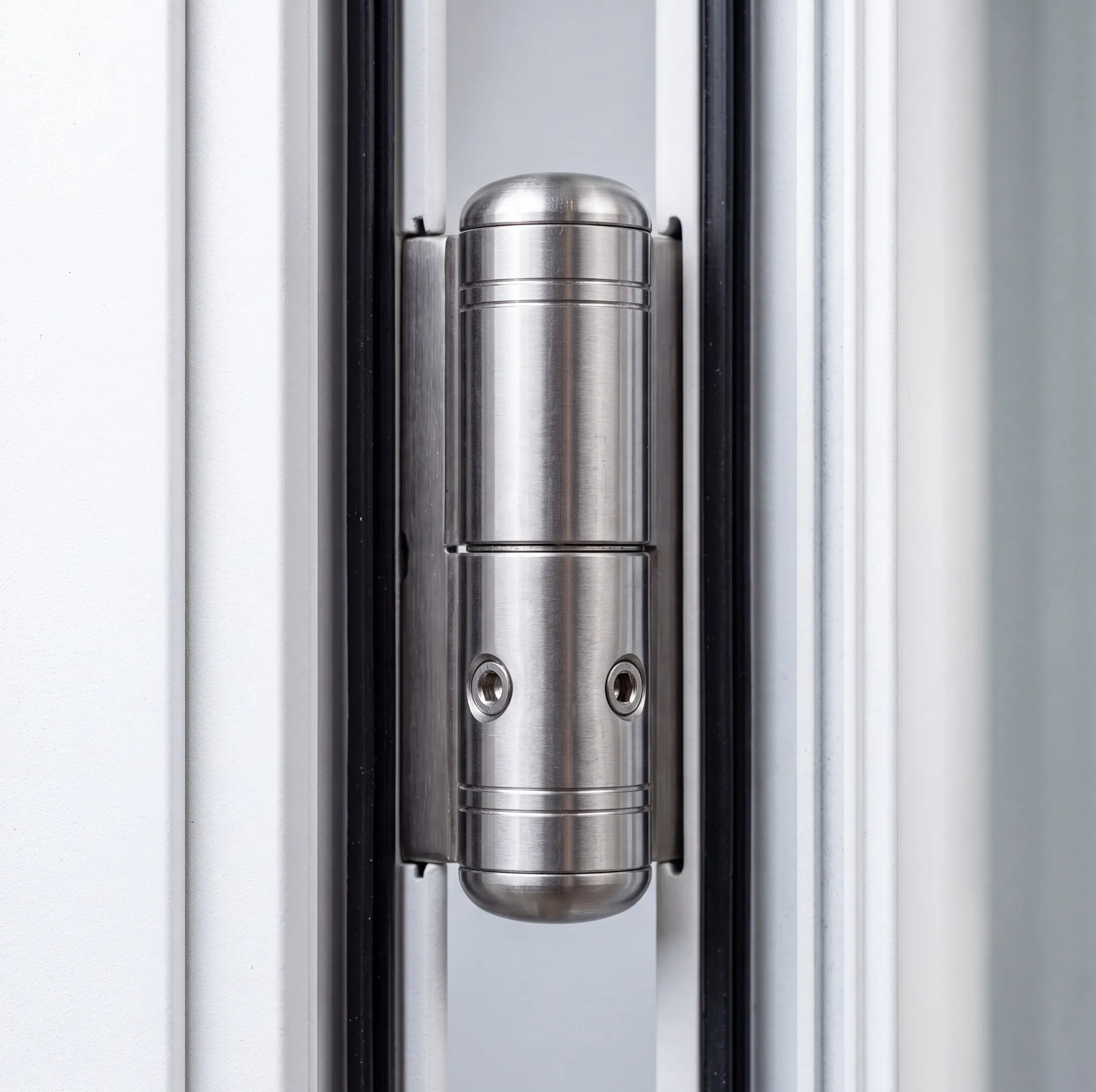 Roller hinge mechanism on an aluminium door profile, close-up