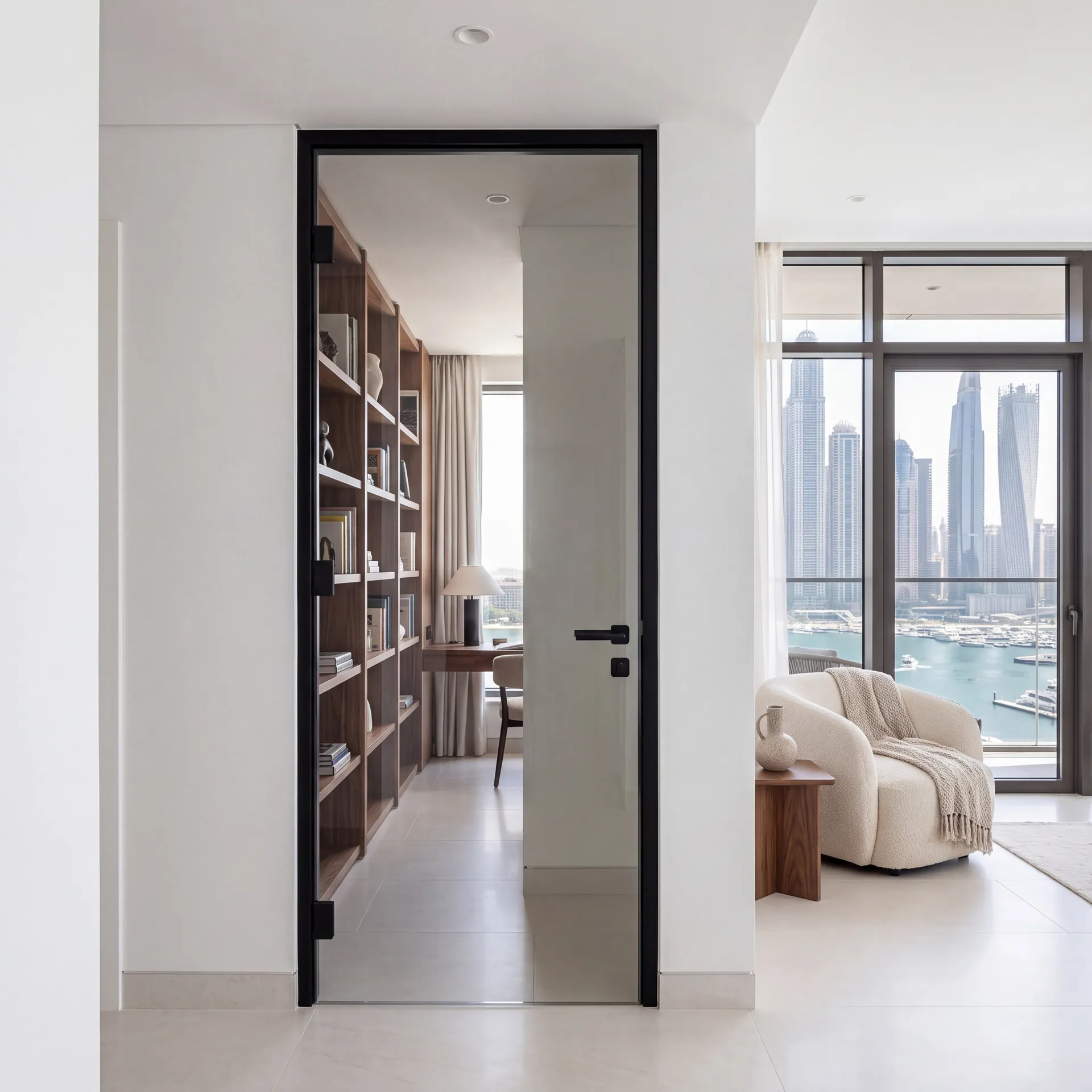 Full-glass aluminium interior door in a modern Dubai apartment