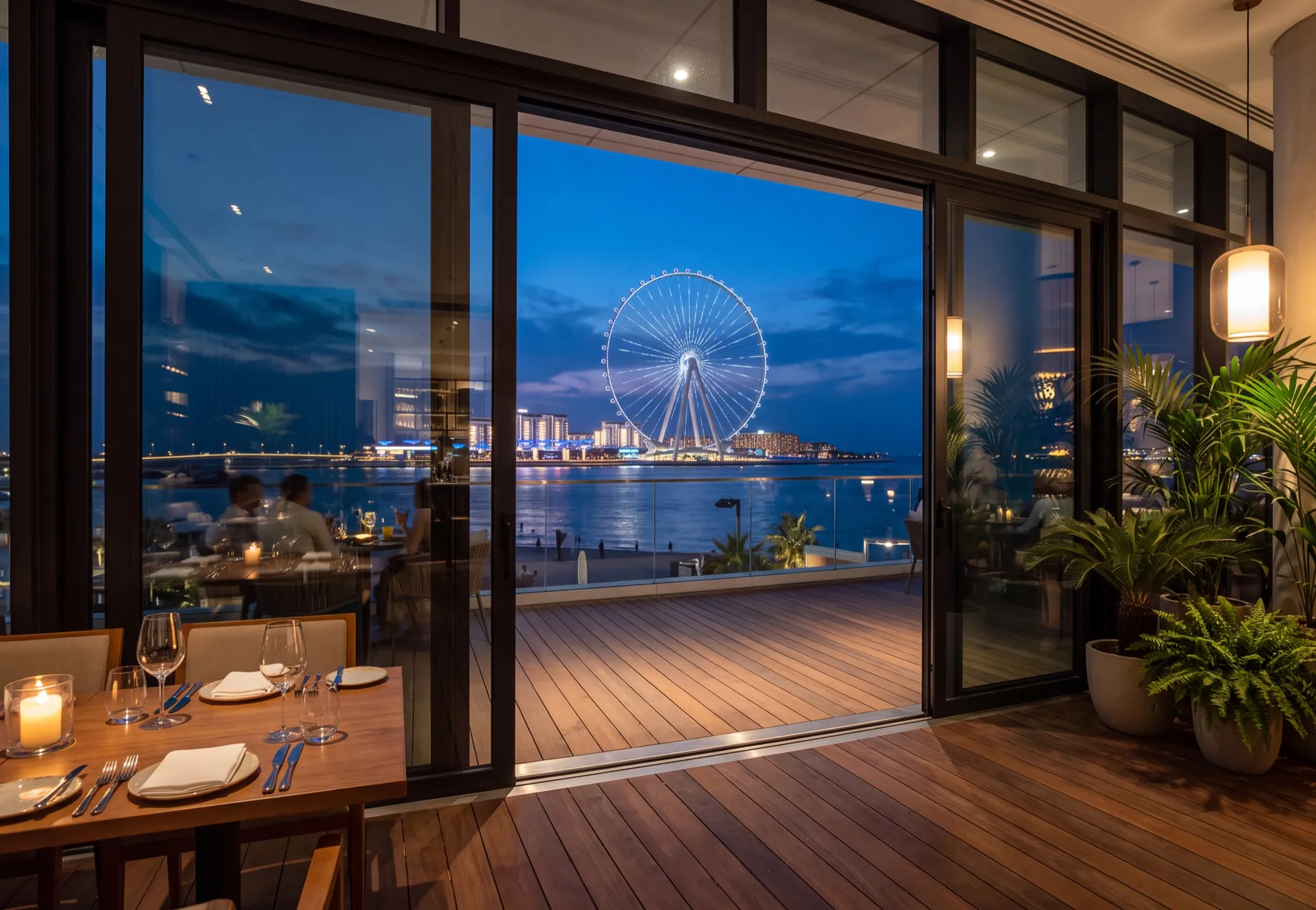 Folding aluminium glazing of a restaurant terrace overlooking Ain Dubai