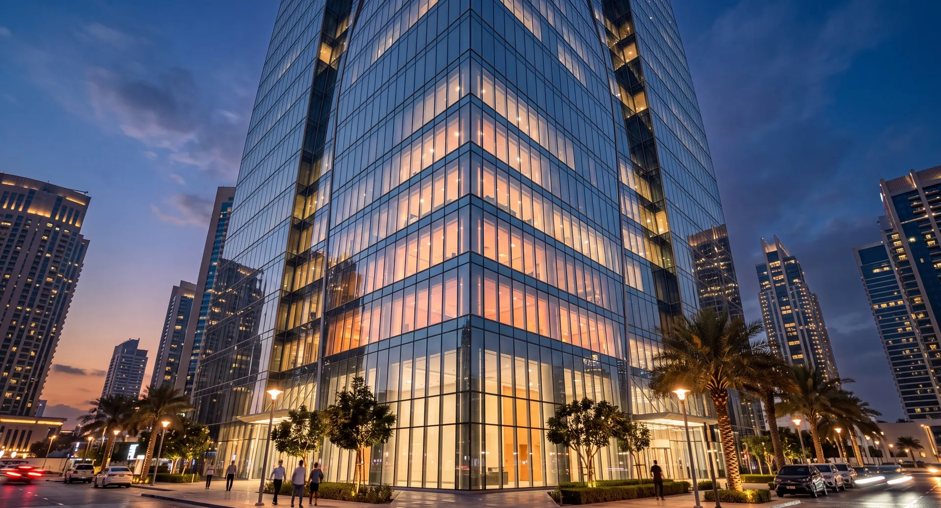 Structural glass facade of a modern building at dusk