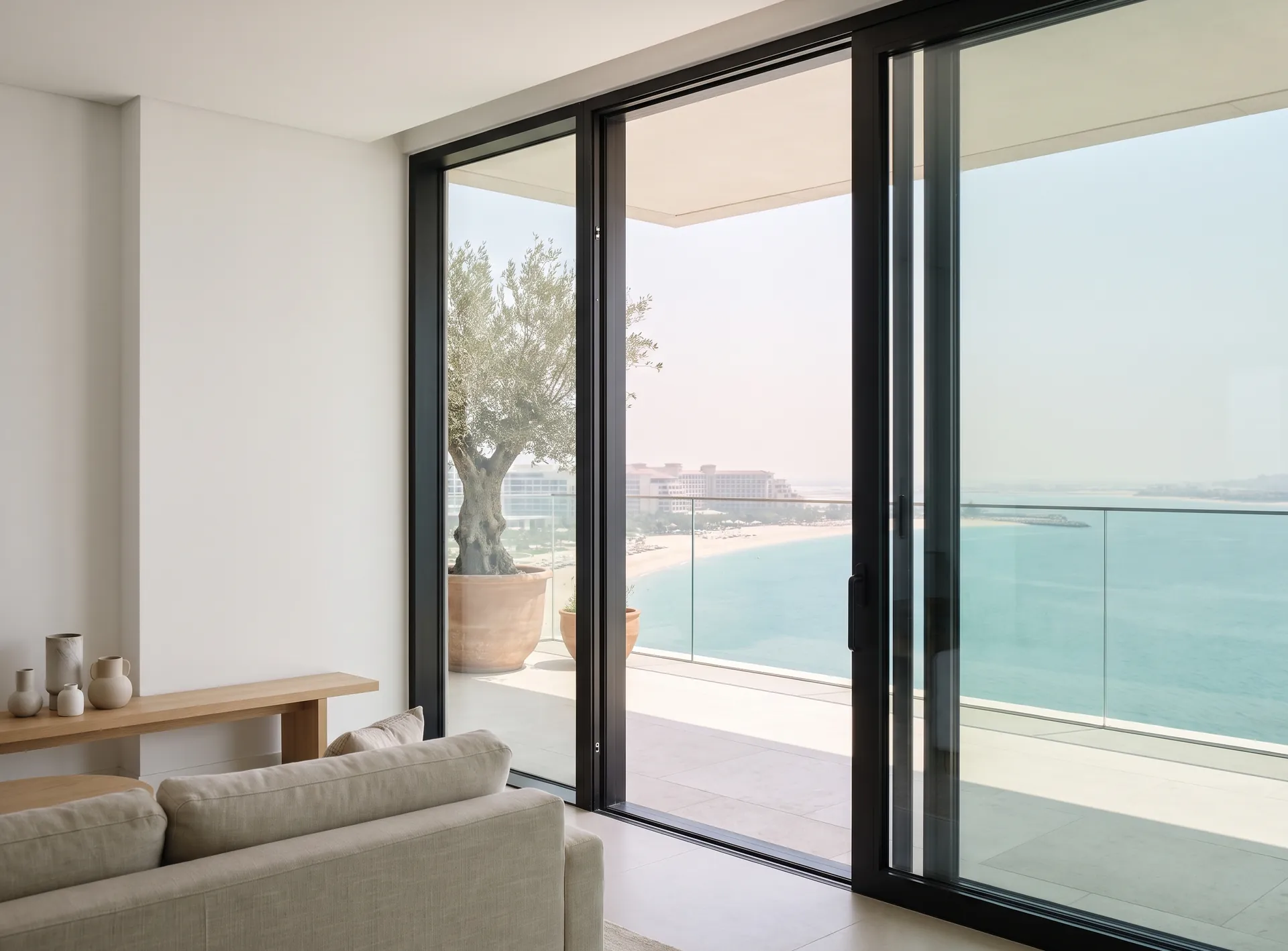 Panoramic sliding aluminium doors on a terrace with a sea view