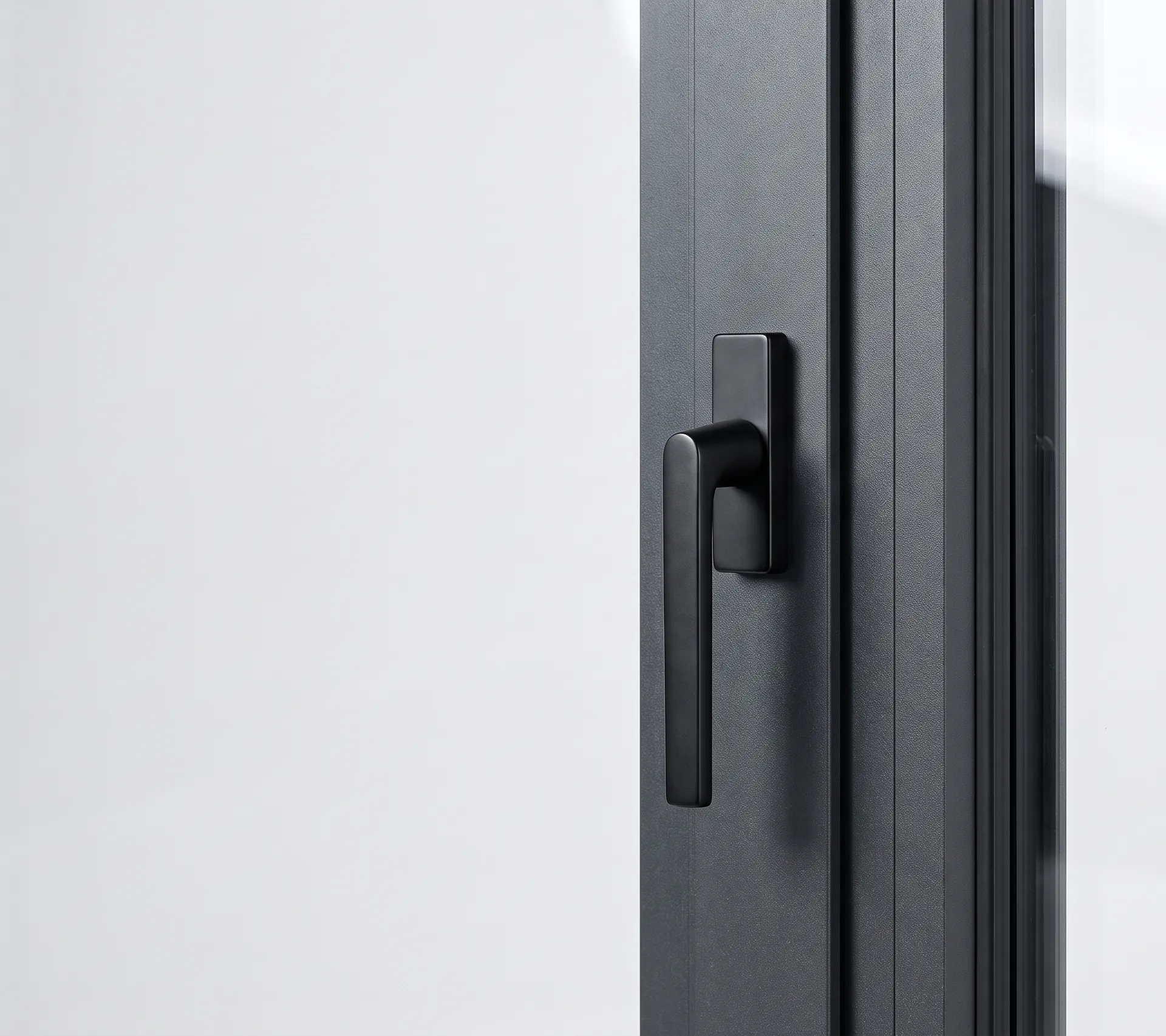 Aluminium window handle on a dark profile