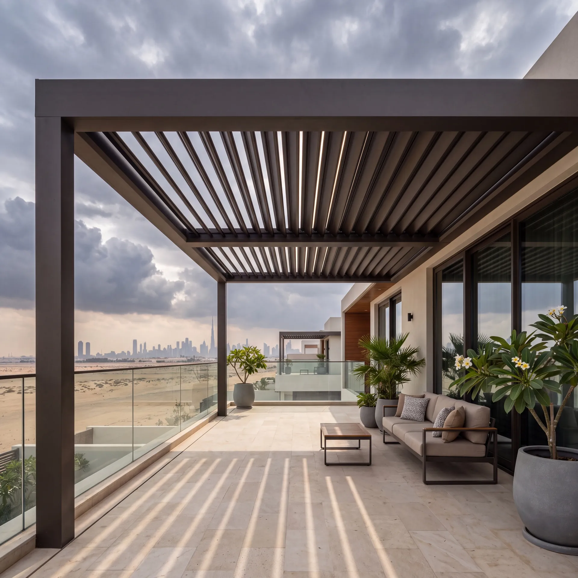 Louvred pergola roof closing itself as clouds gather over a Dubai villa garden